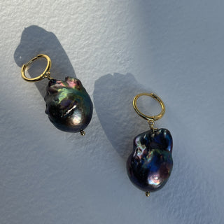 Alma black pearl gold huggie earrings close up
