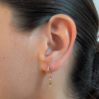 Myla gold huggie earrings tourmaline earrings on model